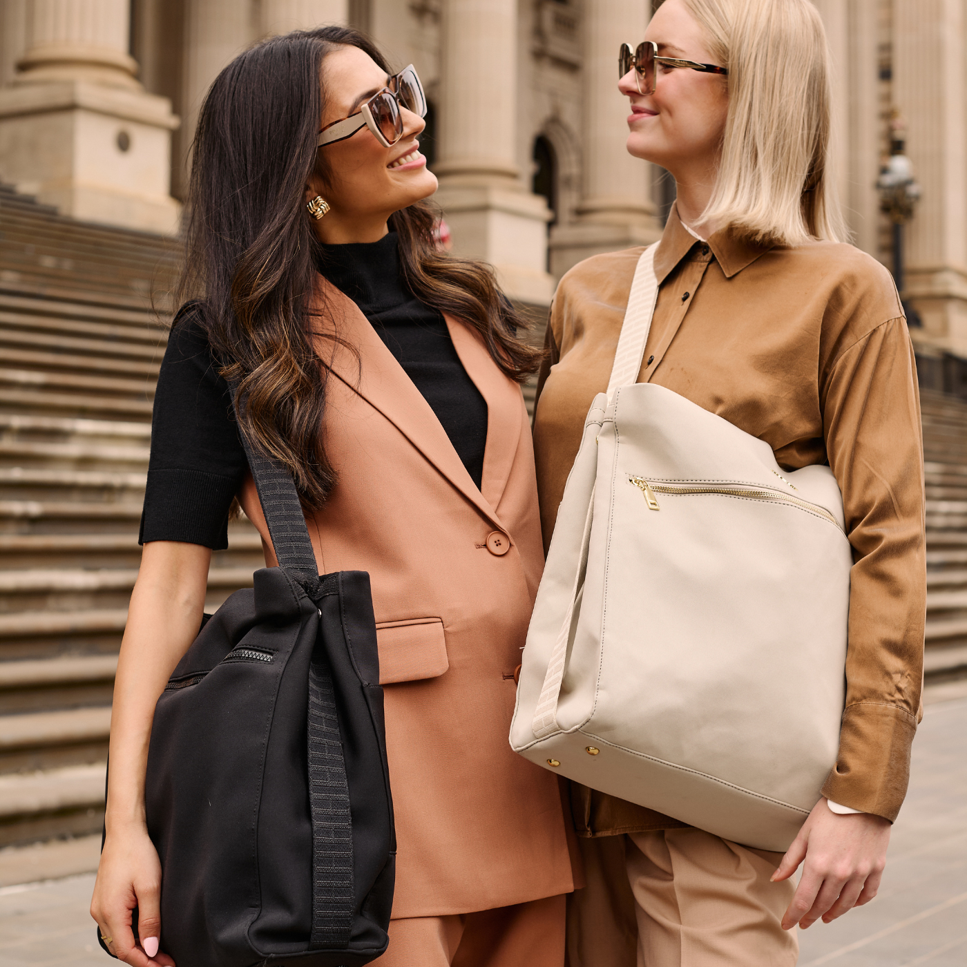 University students carrying neoprene tote bag in black and taupe